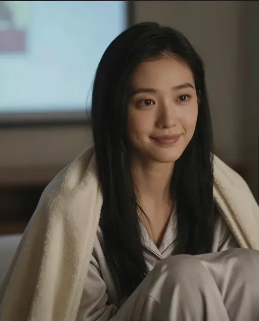 Realistic AI girlfriend wrapped in a blanket on a lazy Sunday